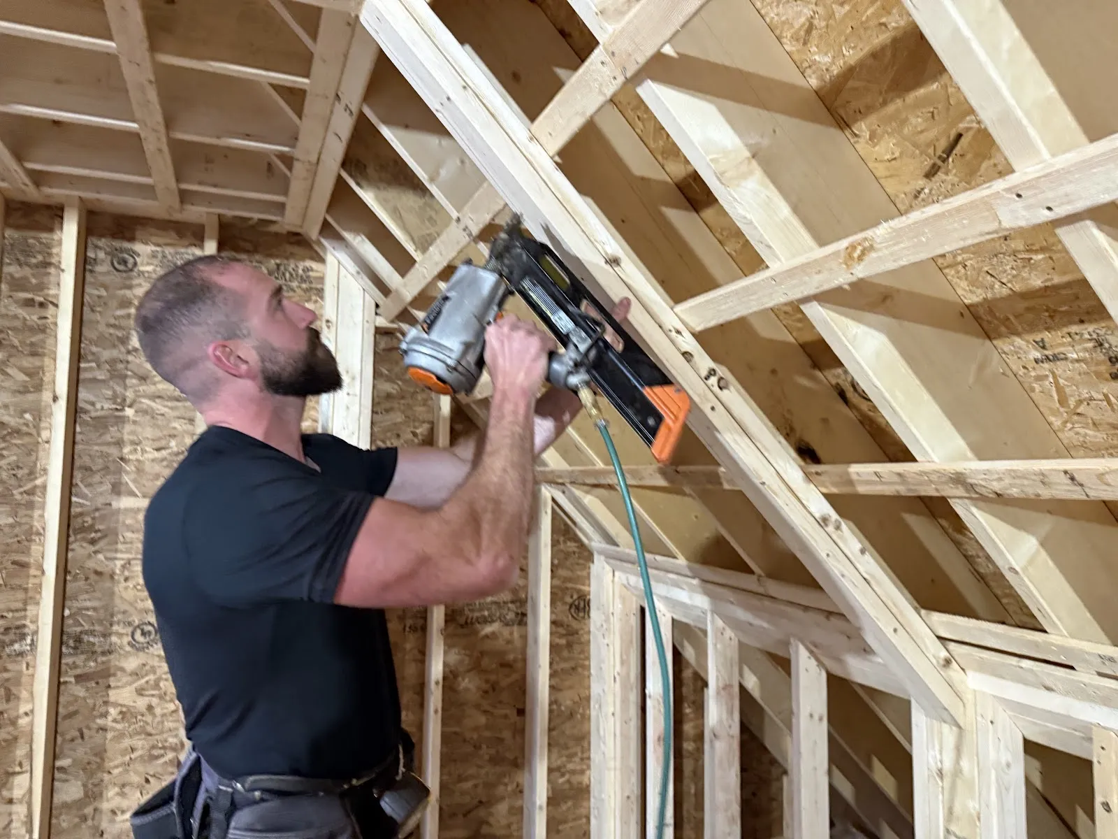 Christian Patoine framing a wall on a Wilderness Woodworking & Construction job in Maine